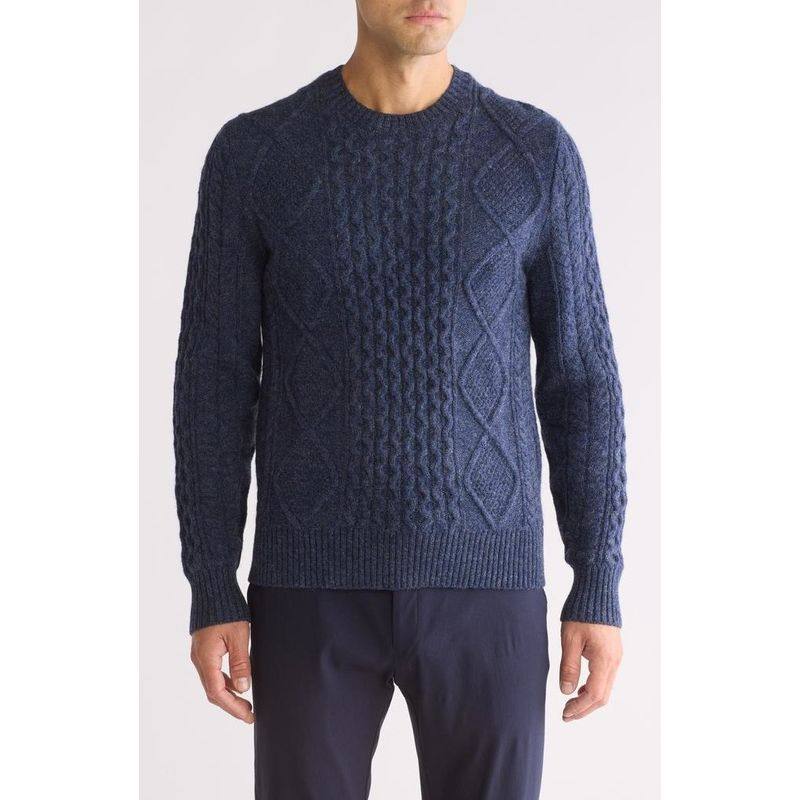 Men's cable knit sweater styled with tailored trousers