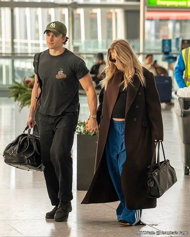 Casual Travel Fashion with Brown Coat and Blue Pants