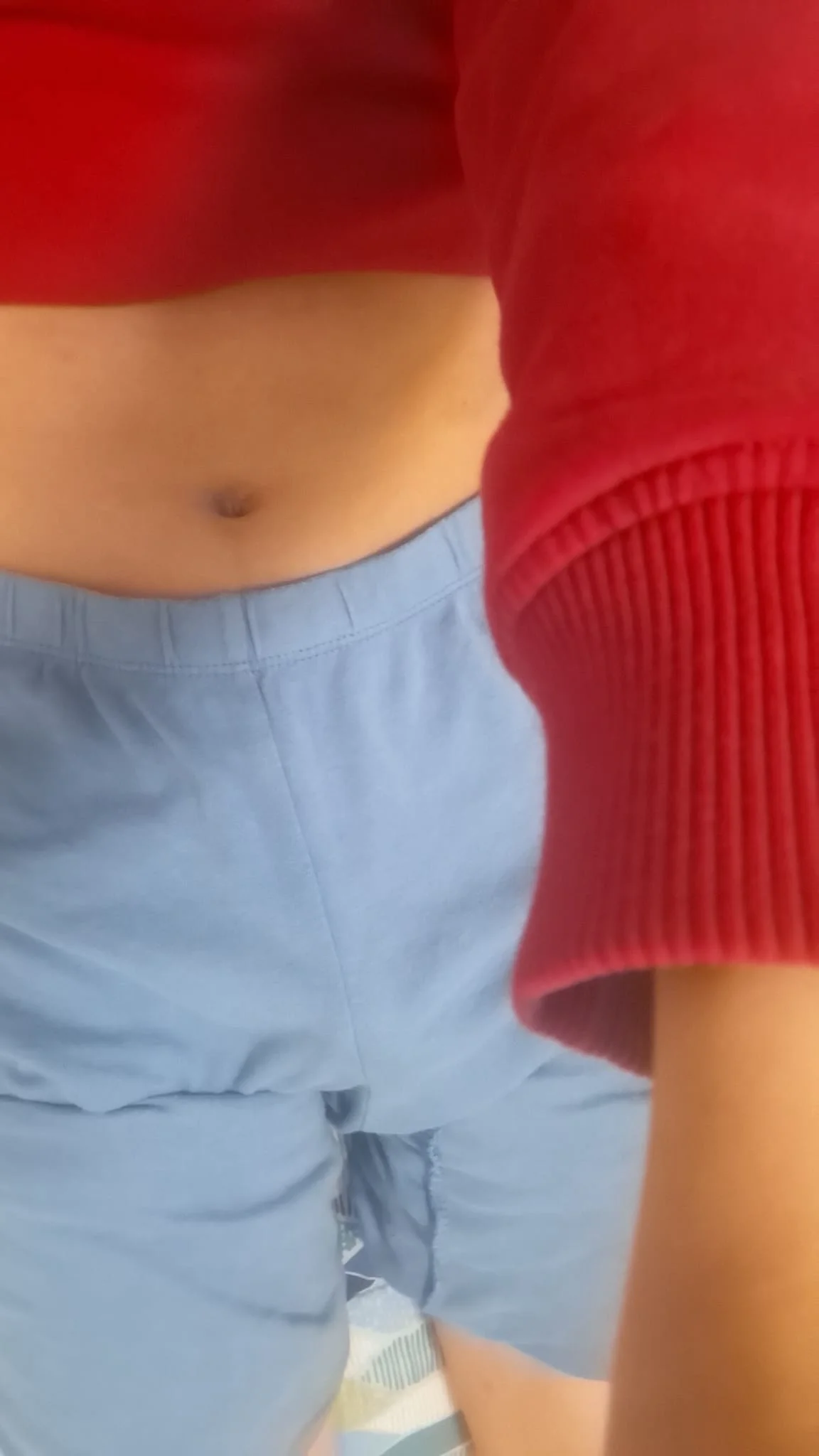 Casual Red Crop Top and Light Blue Shorts Outfit for a Laid-Back Day (a boy wearing this)