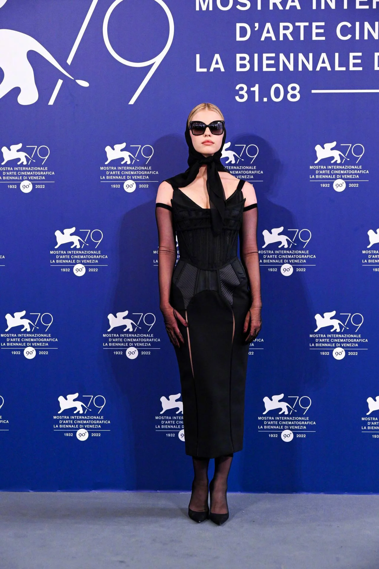Incognito Chic: Bold Black Dress with Mystery Mask and Structured Gloves