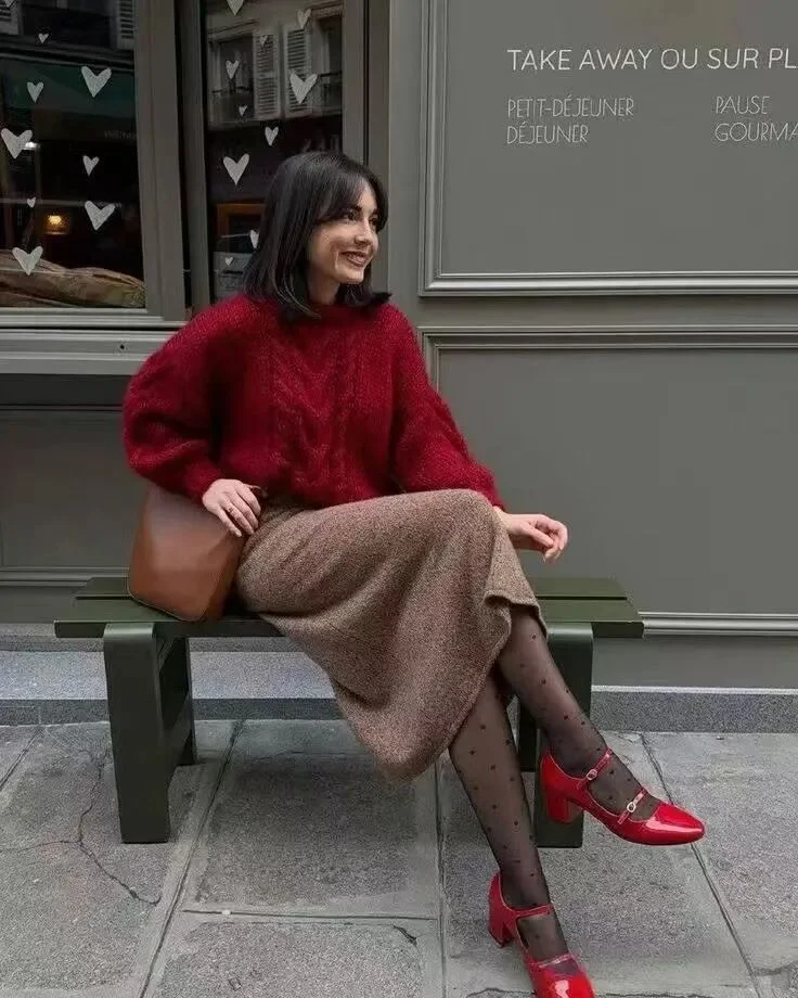 Cozy Chic: Red Cable Knit Sweater and Brown Midi Skirt with Bold Red Accents