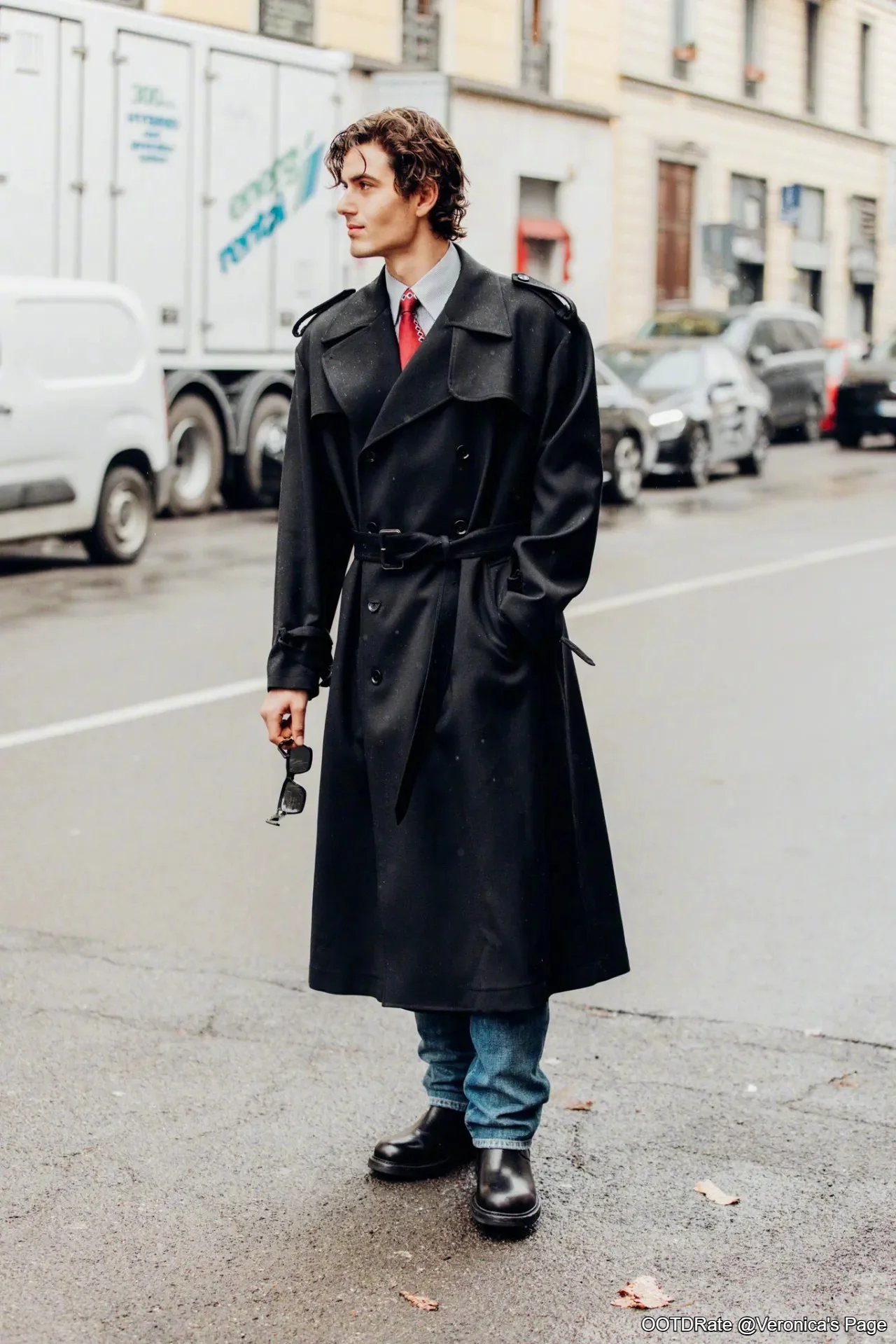 Sophisticated Black Trench Coat with Red Tie and Casual Blue Jeans