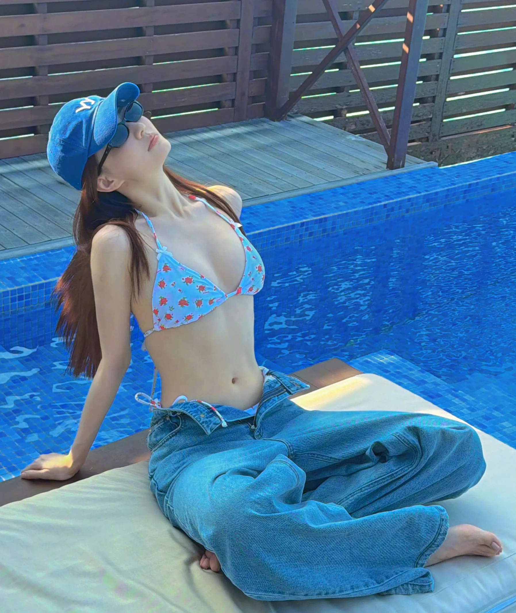 Chic Poolside Style with Floral Bikini and Denim Jeans