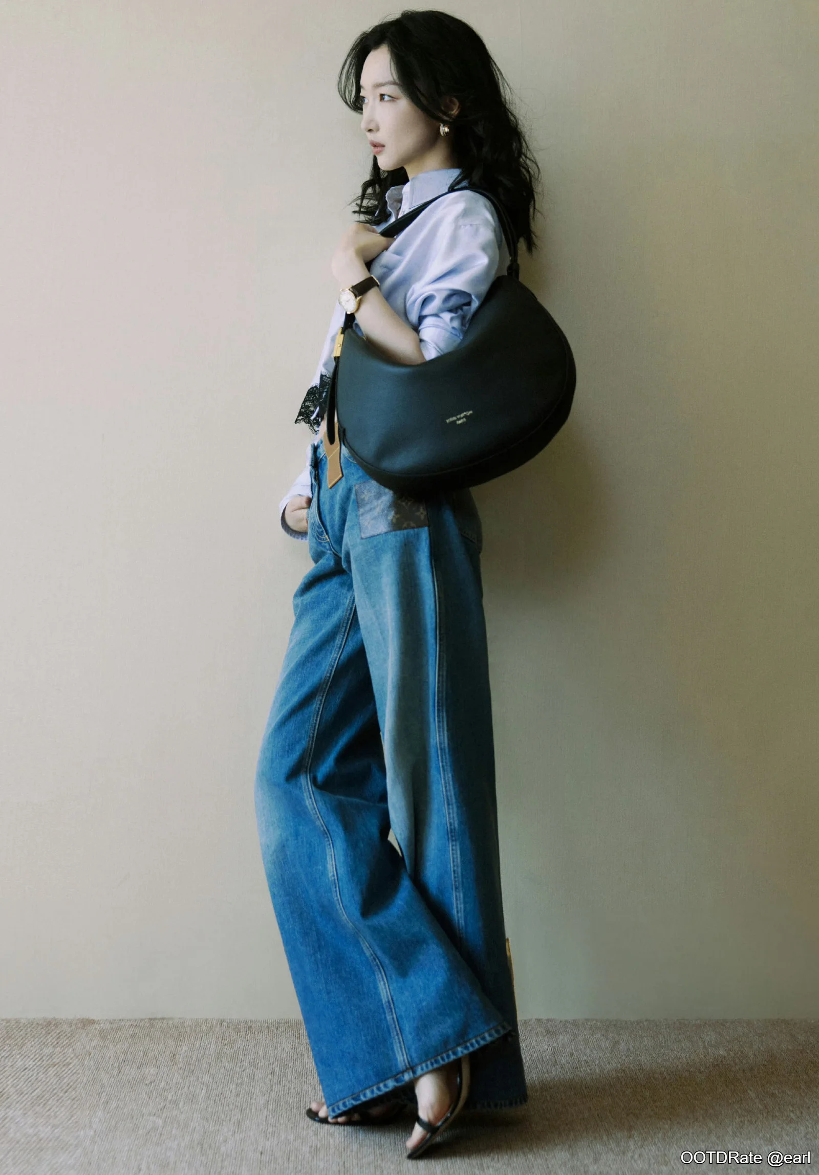 Effortlessly Chic: Light Blue Shirt with Wide-Leg Denim Jeans and Black Accessories