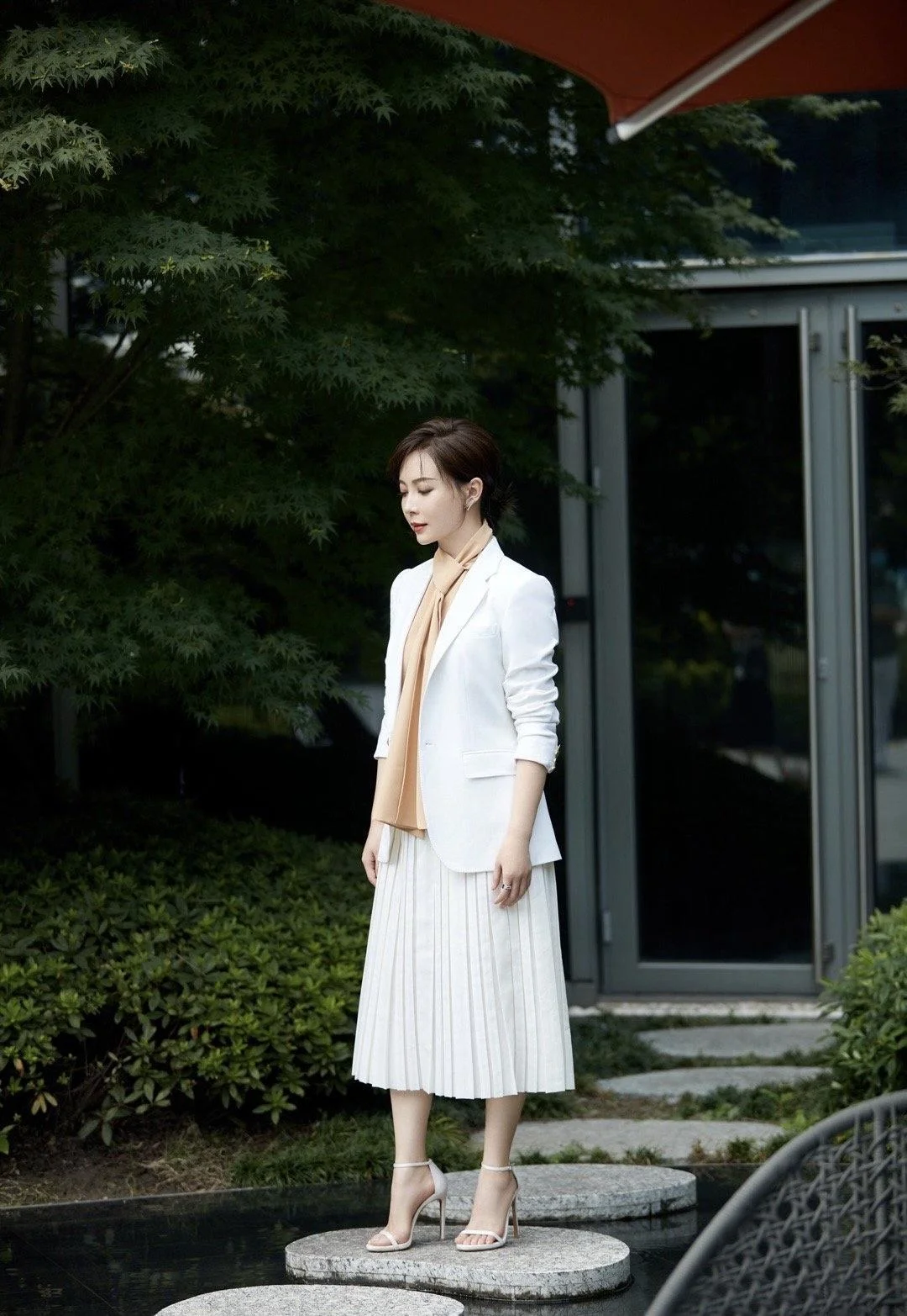 Elegant White Blazer and Pleated Skirt Ensemble with Beige Accents