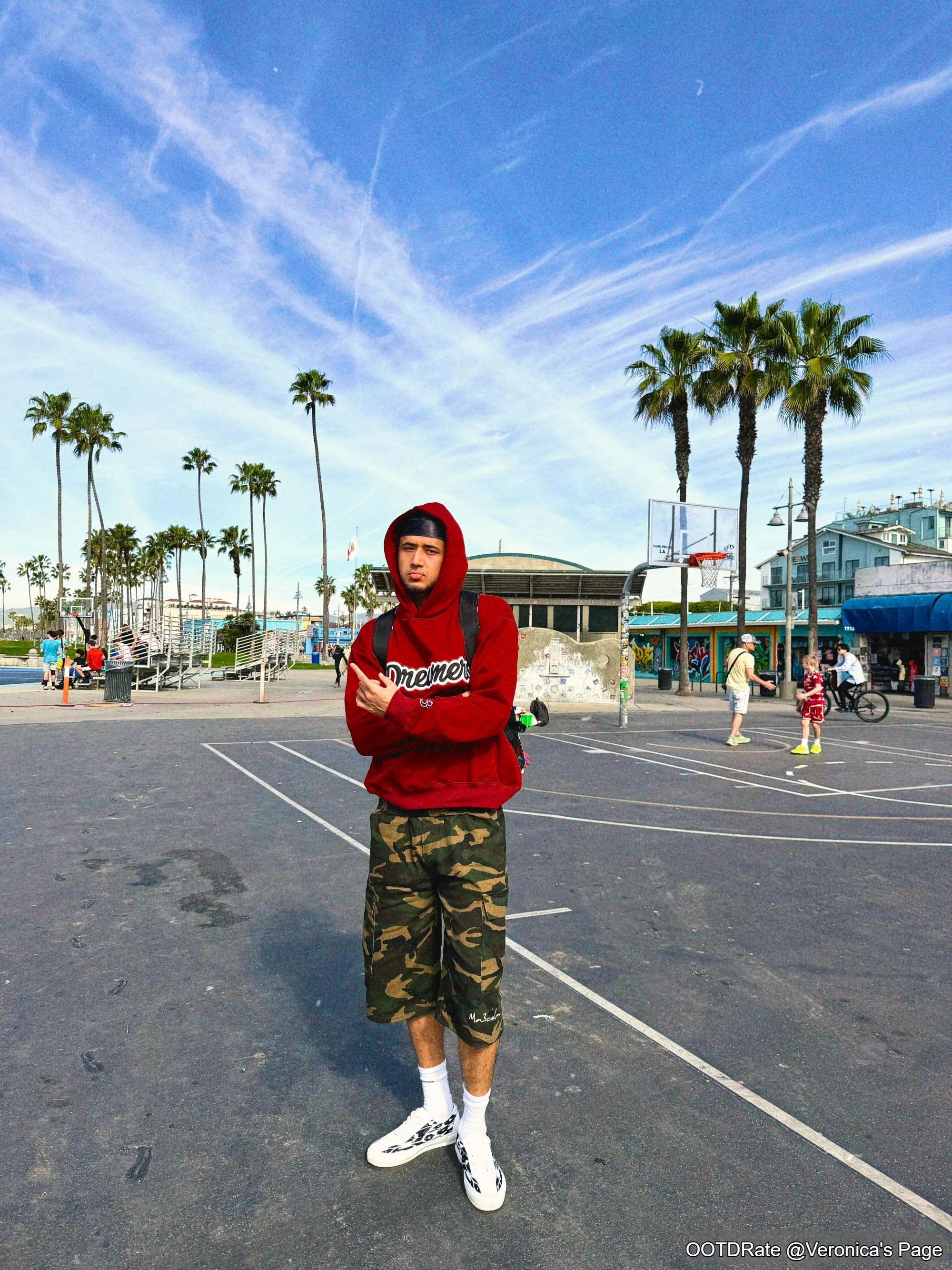 Casual Red Hoodie and Camouflage Shorts for a Sporty Beach Look