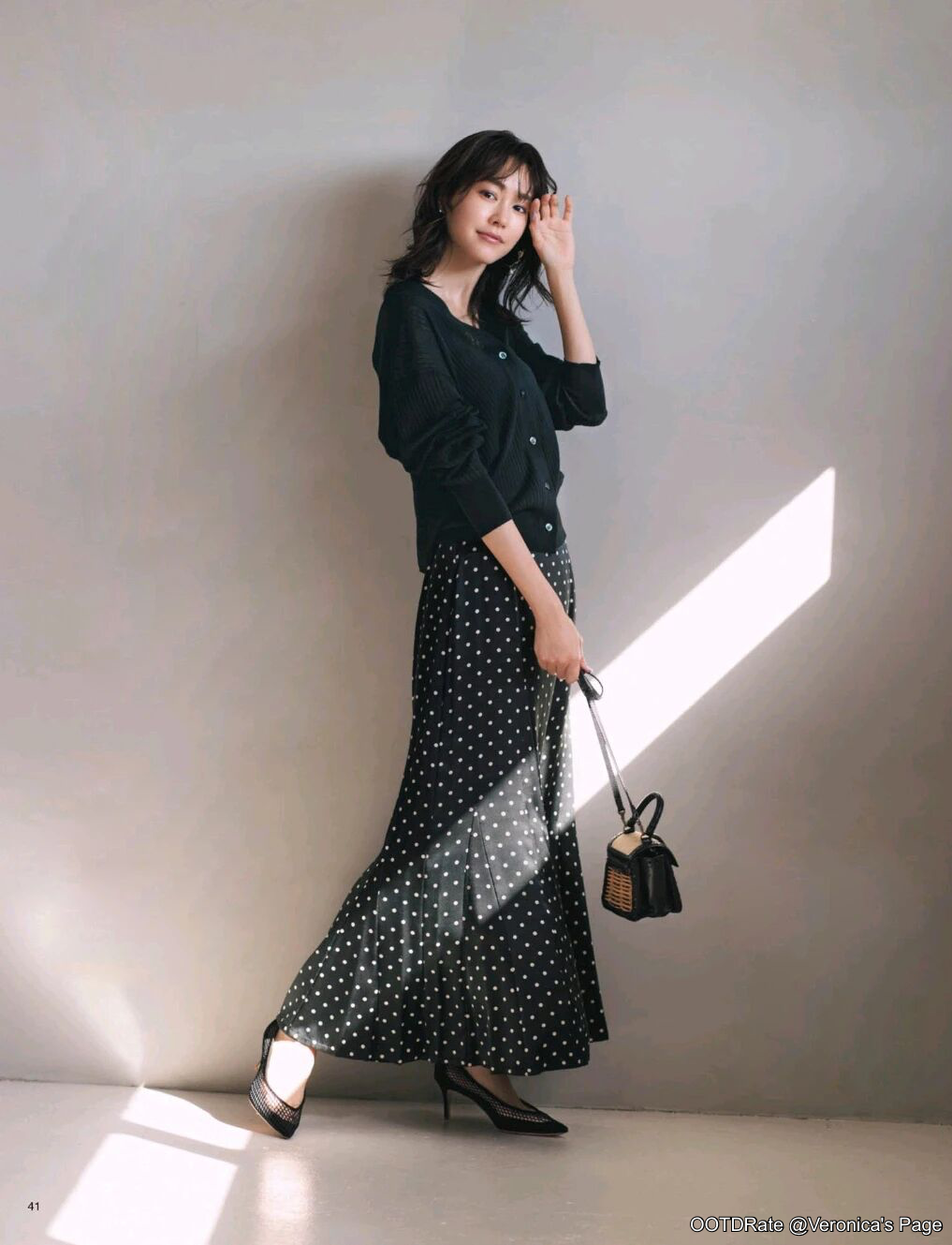 Elegant Black Cardigan and Polka-Dot Skirt Ensemble with Chic Accents