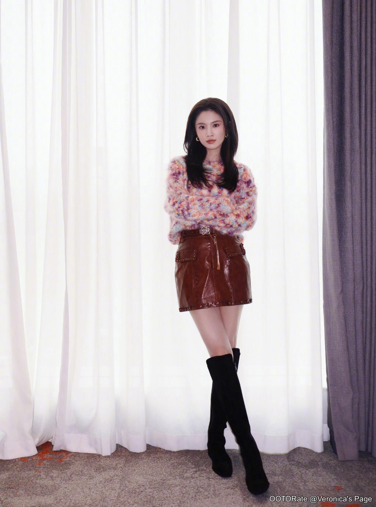 Vibrant Sweater and Leather Skirt with Knee-High Boots for Chic Fall Style