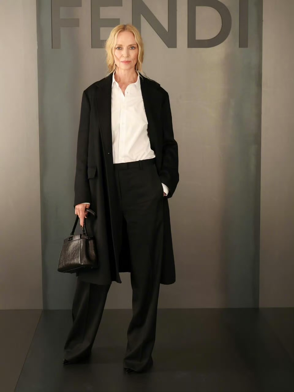 monochromatic elegance: black coat and trousers with white shirt ensemble