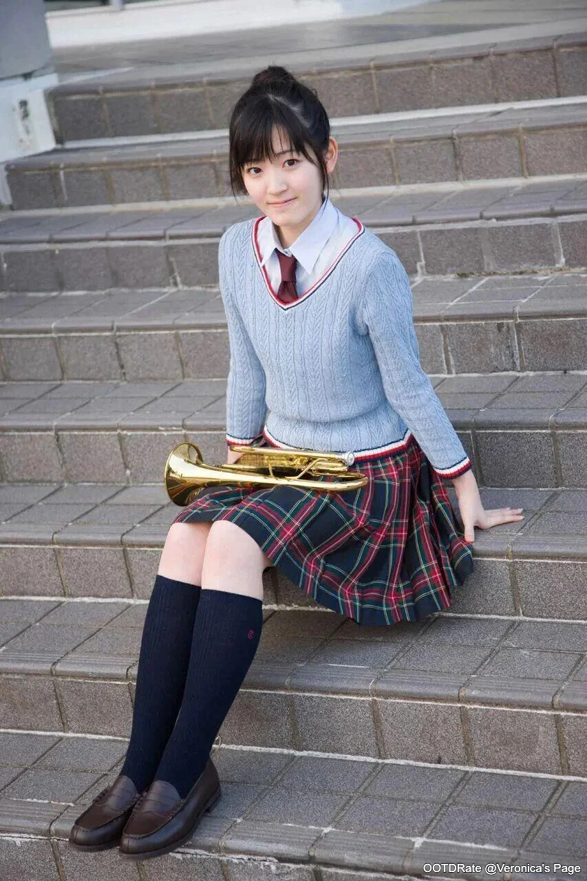 Classic Schoolgirl Style with Blue Cable-Knit Sweater and Plaid Skirt