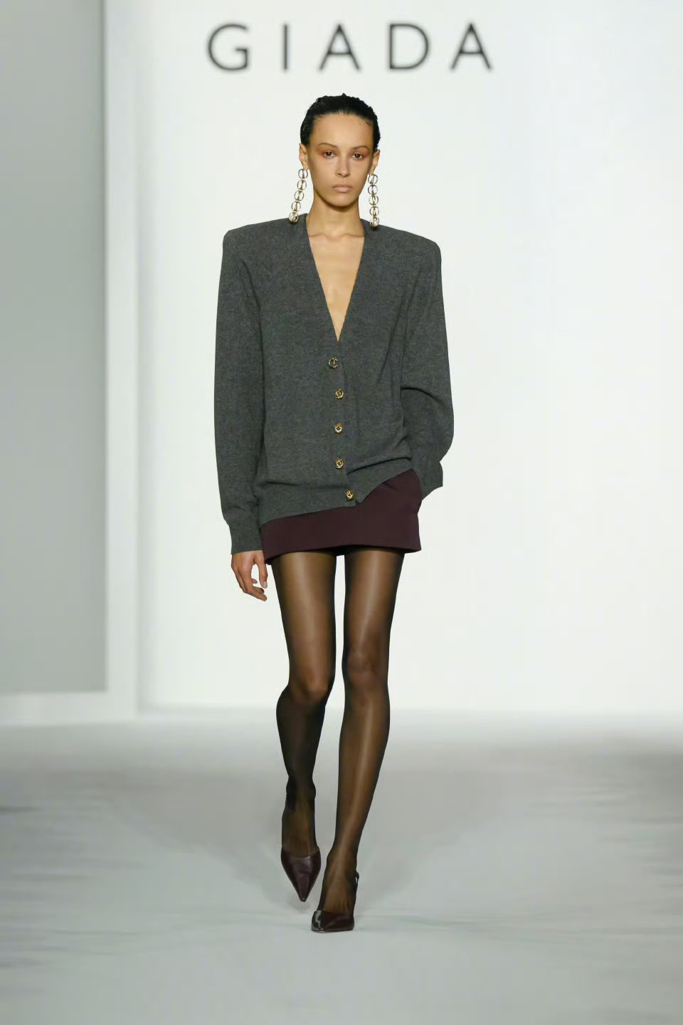Chic Contrast: Oversized Gray Blazer and Maroon Mini Skirt with Sheer Tights