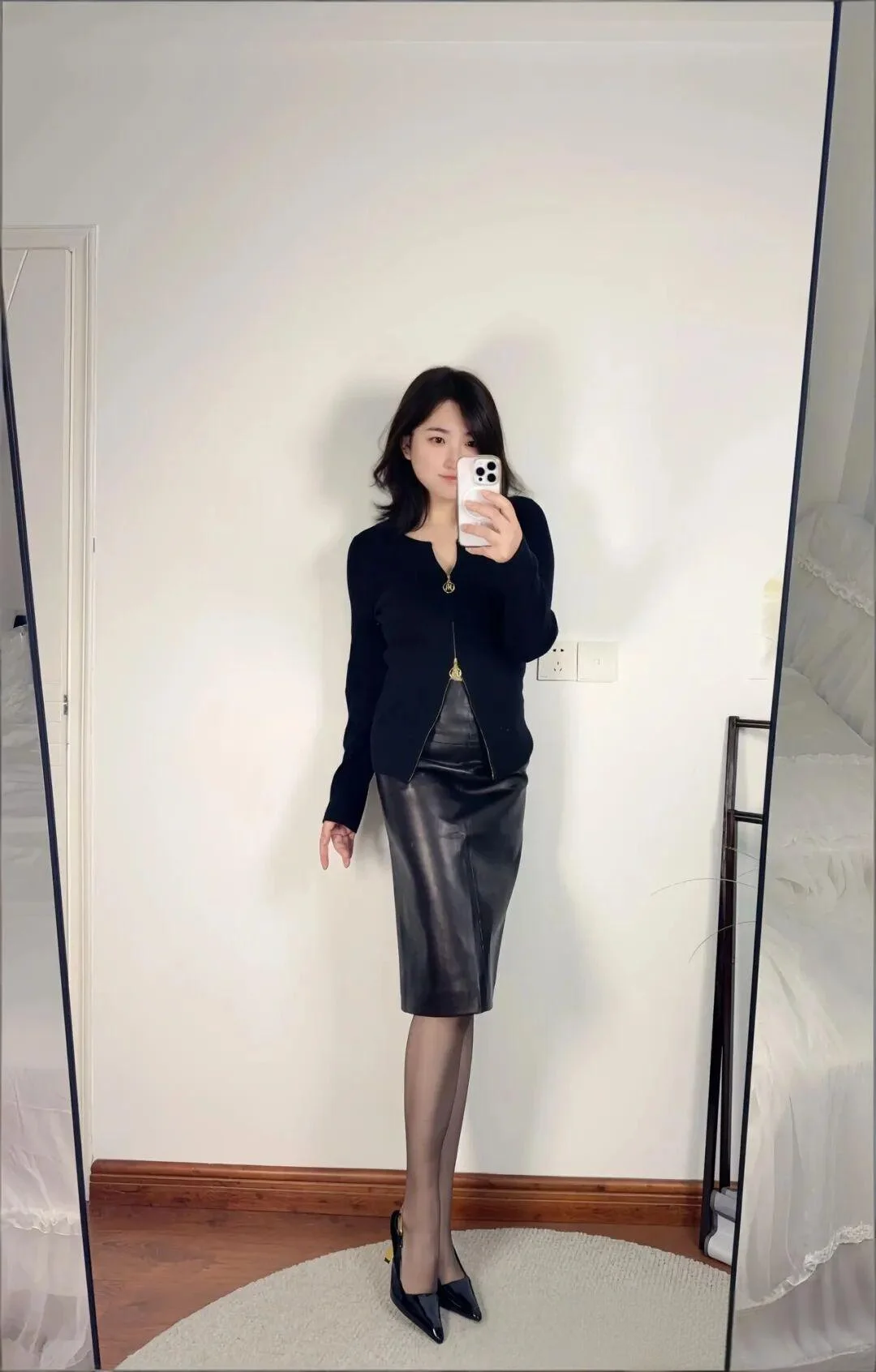 Sleek Black Ensemble with Leather Pencil Skirt and Heels for a Sophisticated Look