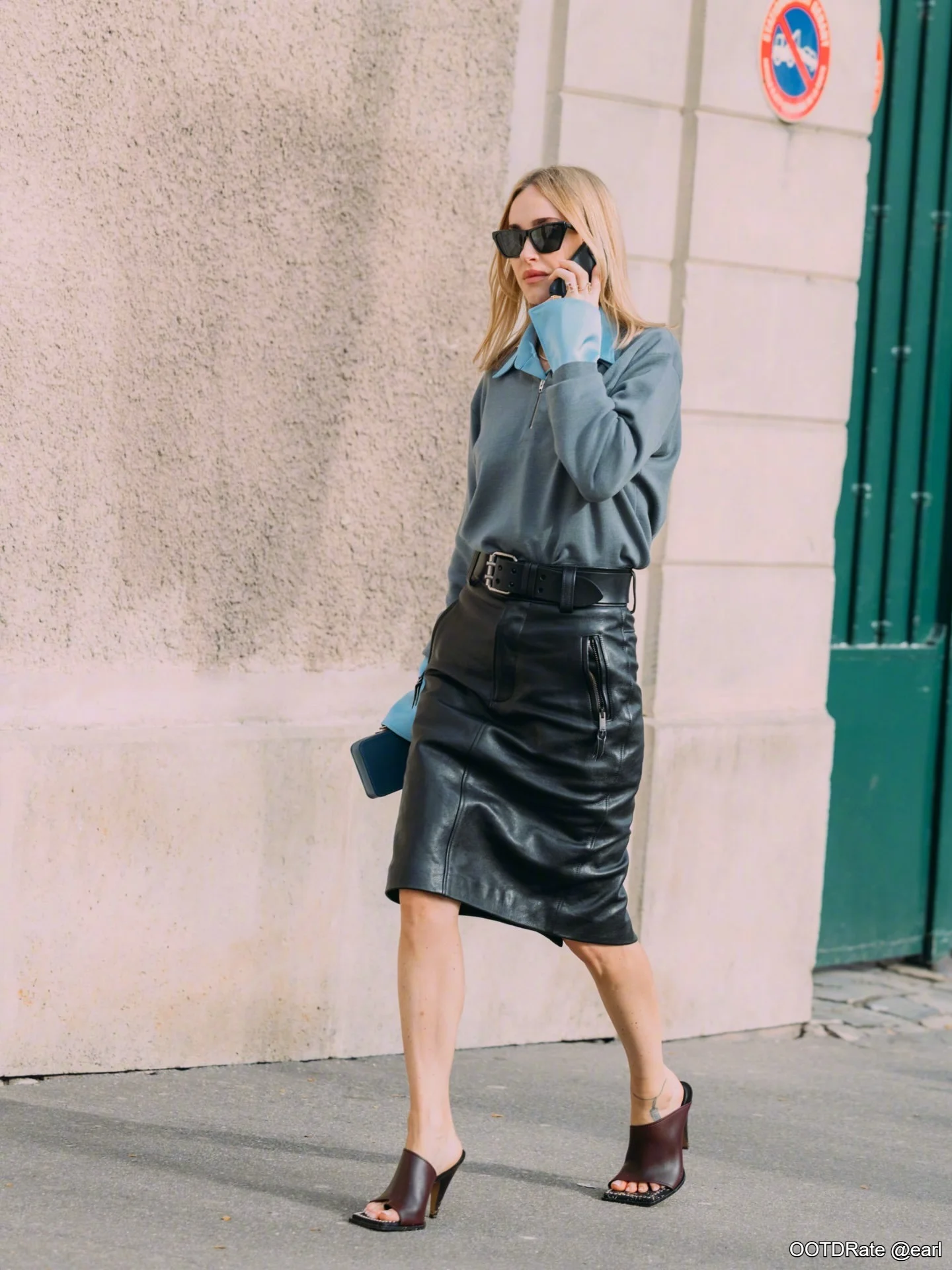 Elegant Urban Style: Blue Shirt, Leather Skirt, and Chic Accessories