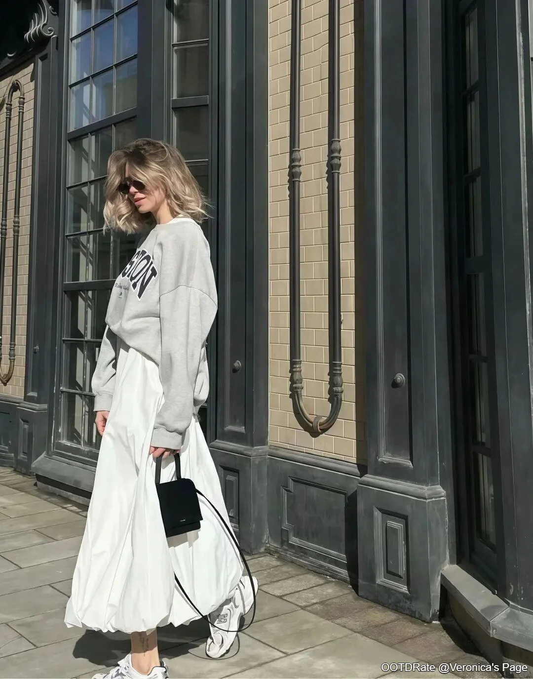 Casual Elegance with Gray Sweatshirt and White Skirt Ensemble