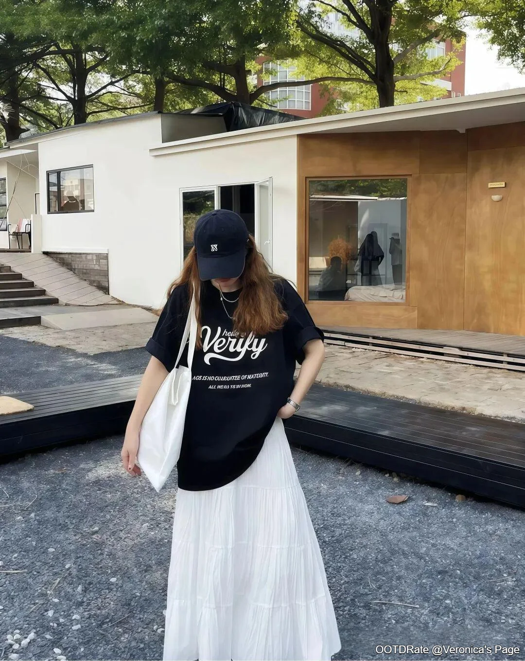 Monochrome Streetwear Style with a Black Graphic Tee and White Maxi Skirt