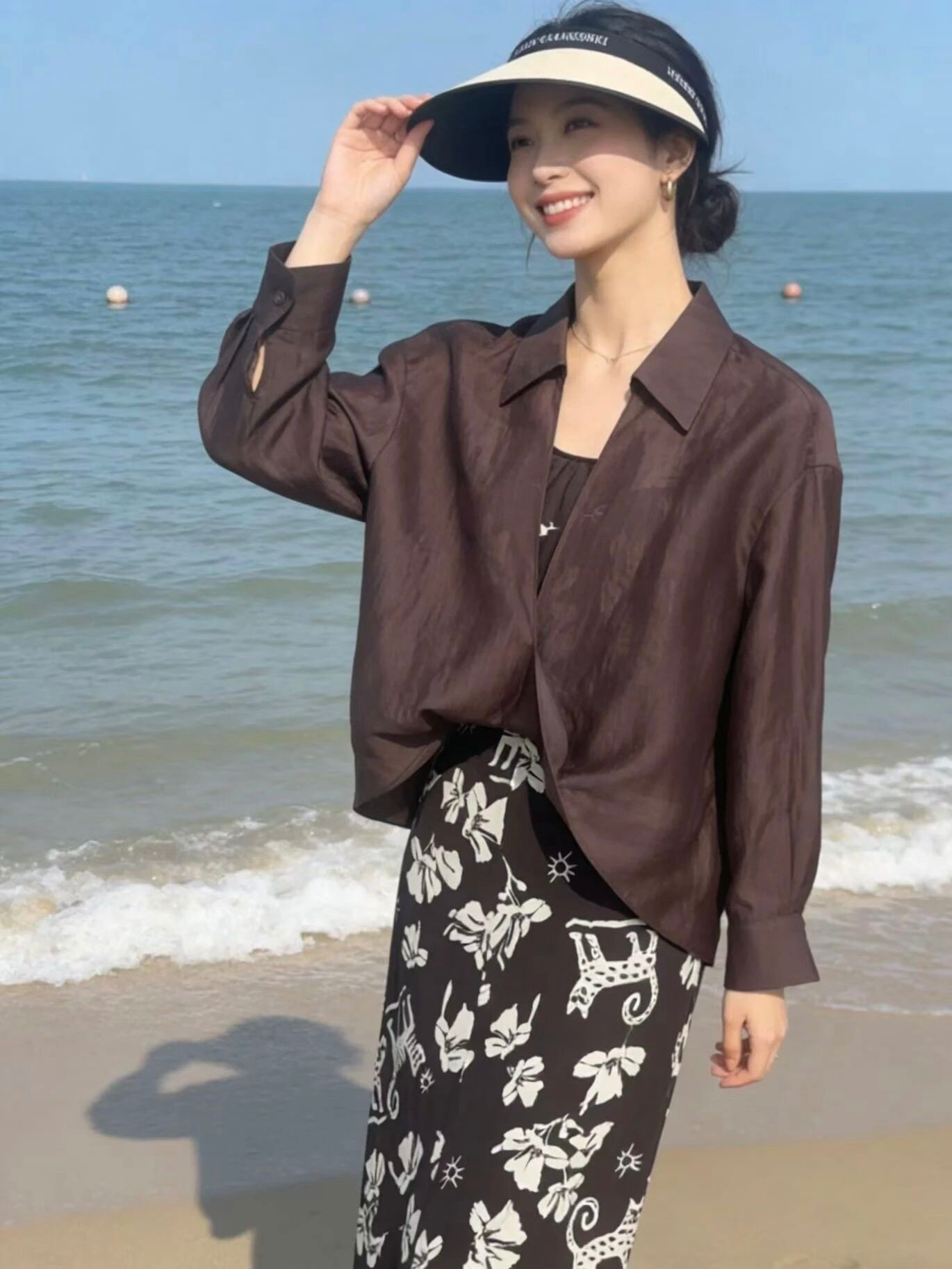Effortless Beach Style: Brown Button-Down and Patterned Skirt Ensemble