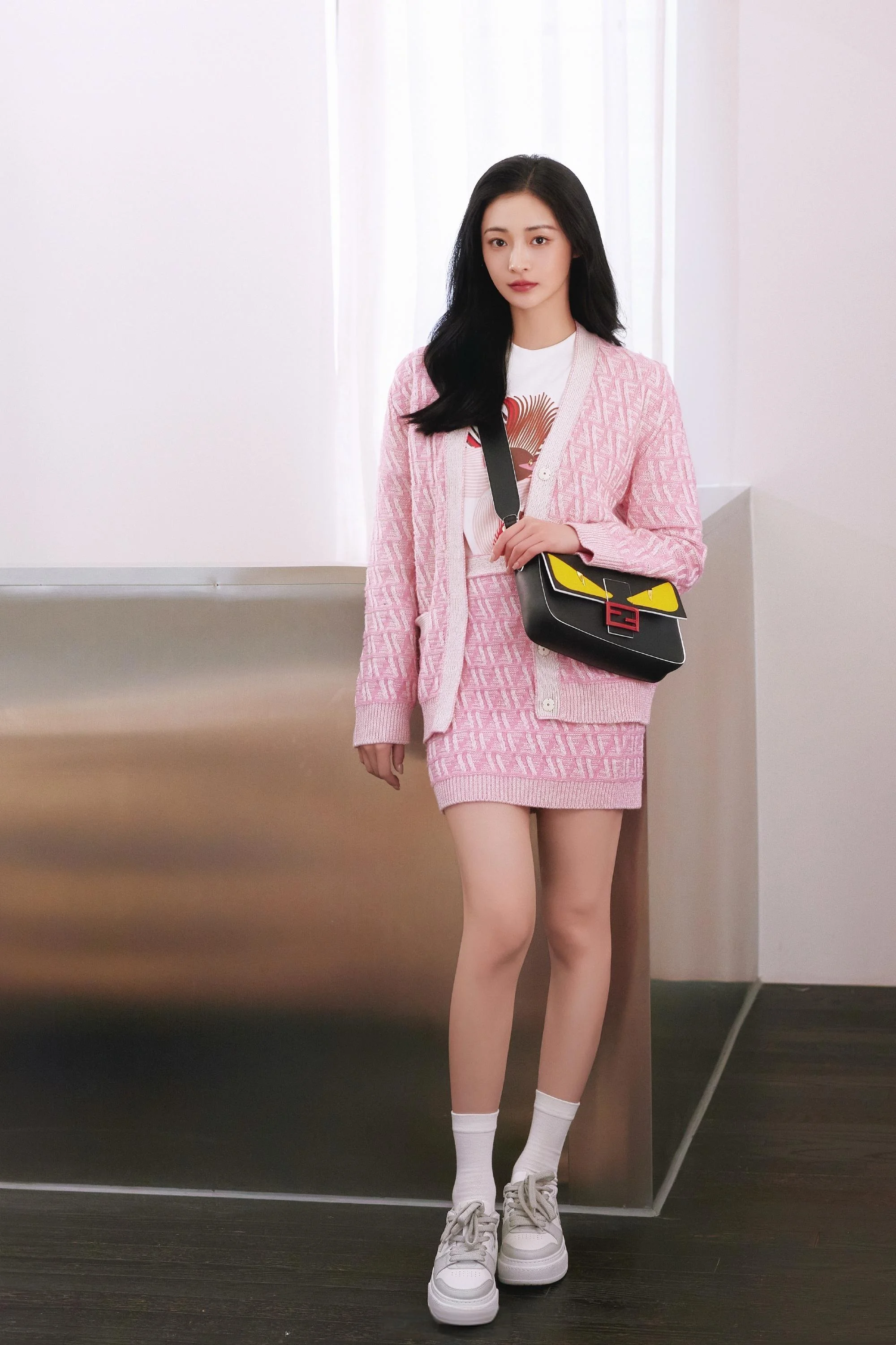 Chic Pastel Pink Cardigan and Skirt Set with Graphic Tee and Sneakers