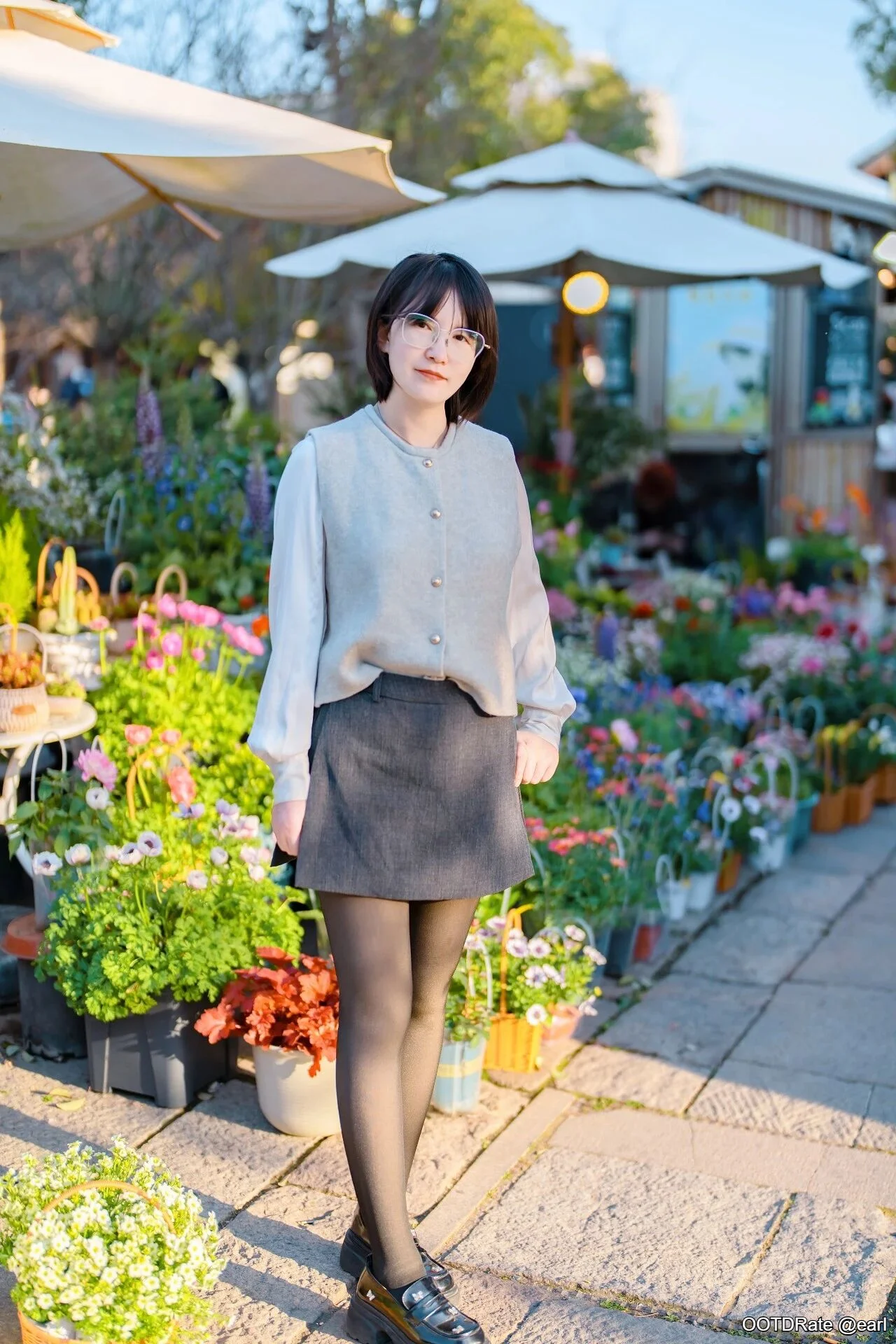 Sophisticated Neutrals: Layered Vest and Skirt Ensemble with Chic Accessories