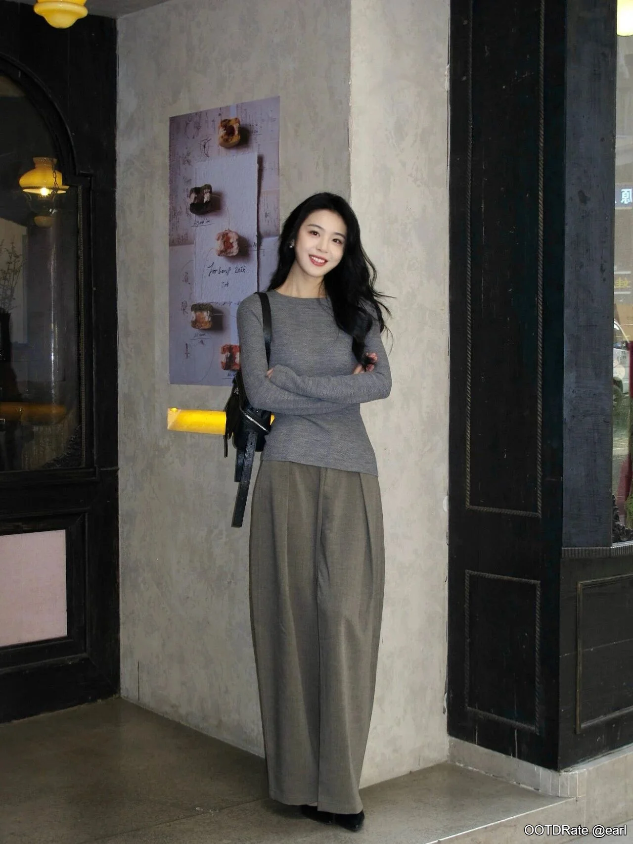 Minimalist Chic: Gray Top with Wide-Leg Trousers and Black Accessories