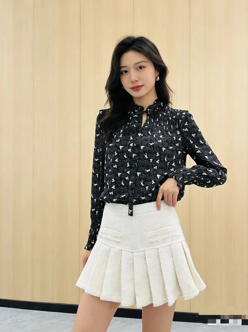 Timeless Black and White Ensemble with Playful Pleated Skirt