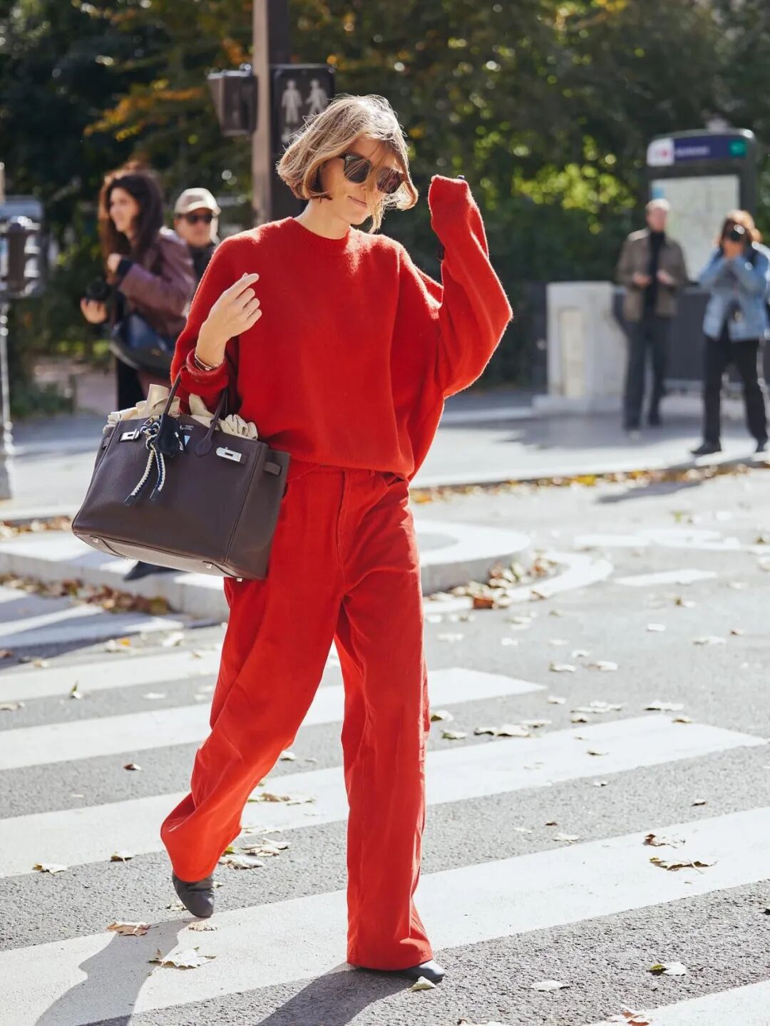 Red corduroy wide-leg pants for a bold winter statement