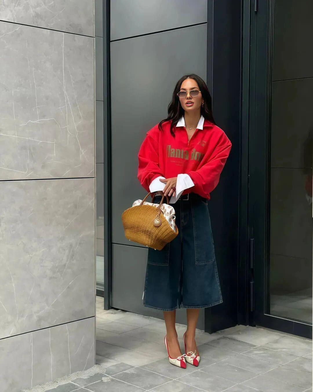 Sweatshirt and shirt layered with denim skirt for retro spring style