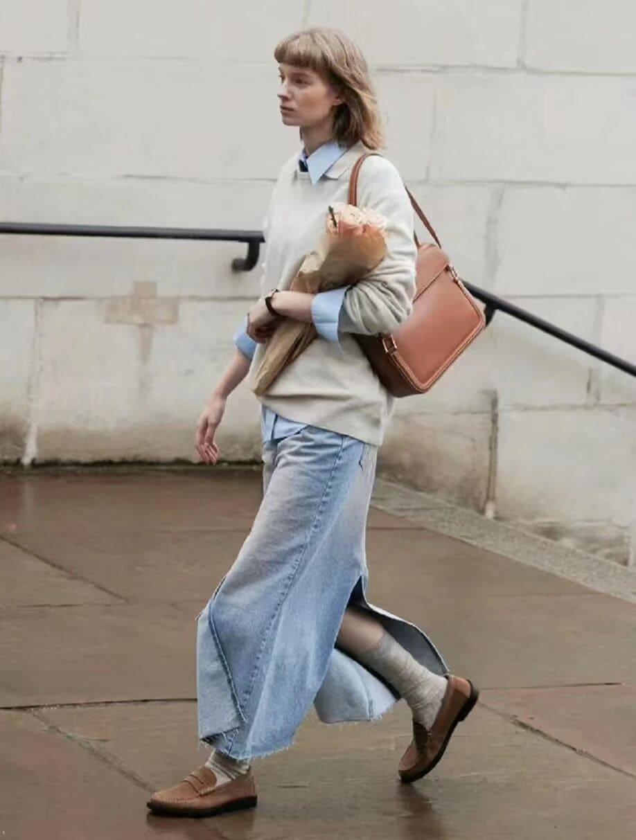 Denim skirt outfit with sweatshirt shirt layering