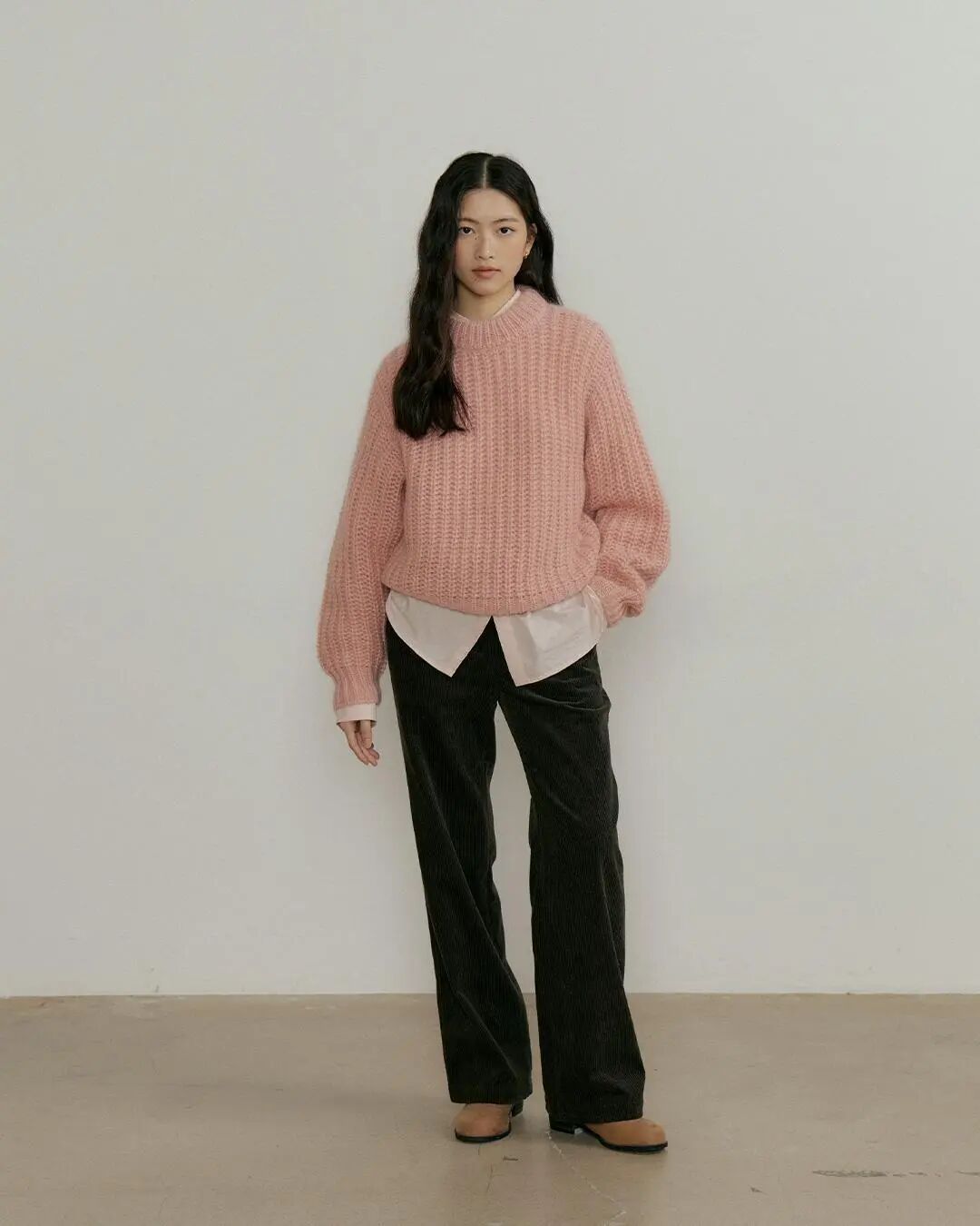 Wide-leg corduroy pants paired with cozy knitwear