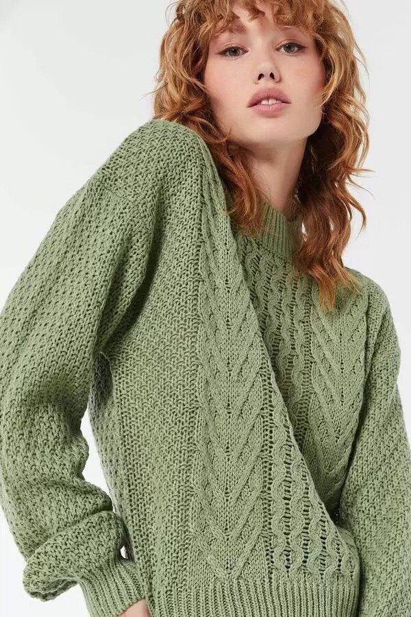 Women's cable knit sweater with classic textured pattern